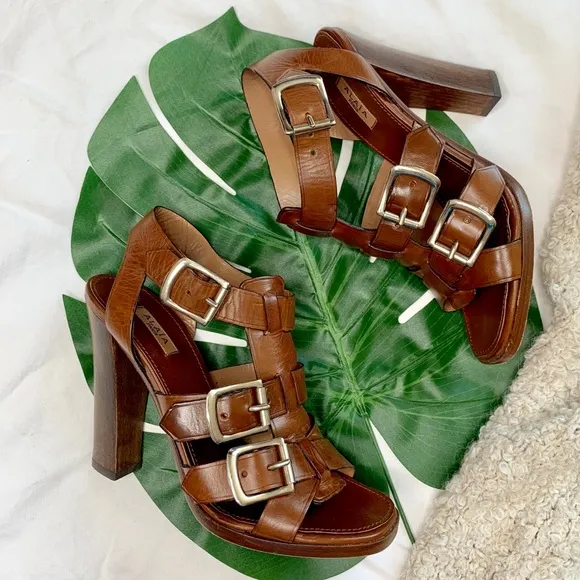 ALAïA cage sandals with buckle accents