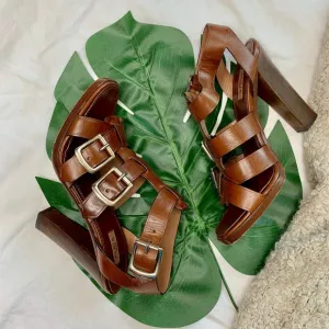 ALAïA cage sandals with buckle accents