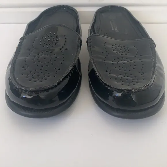 Eric Michael black patent leather perforated slip on mules in size 41