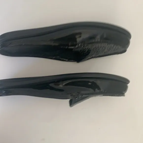 Eric Michael black patent leather perforated slip on mules in size 41