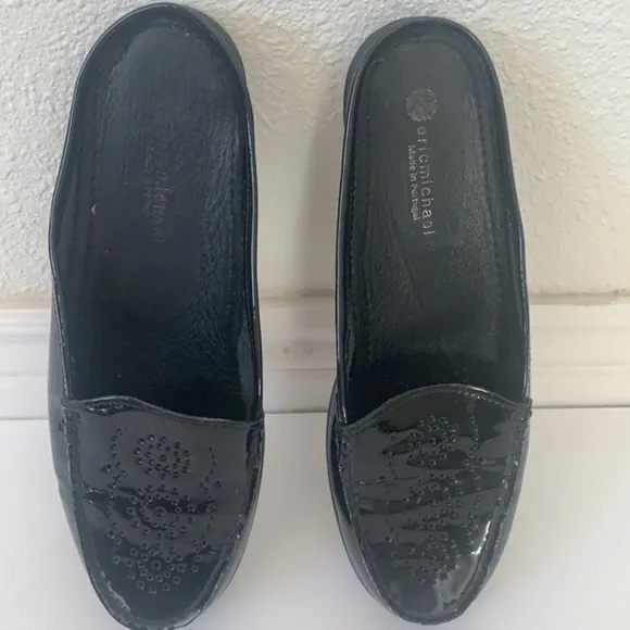Eric Michael black patent leather perforated slip on mules in size 41