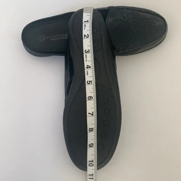 Eric Michael black patent leather perforated slip on mules in size 41