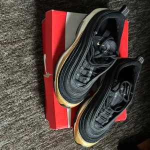 Nike Black and Gold Sleek Sneakers